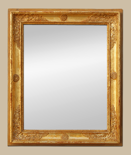 Glace miroir ancien d'époque Restauration, bois doré