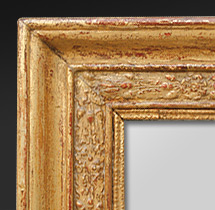 Miroir ancien dorure à la feuille décors feuilles