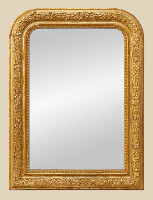 Miroir Louis-Philippe doré à la feuille à décor de feuillages stylisées