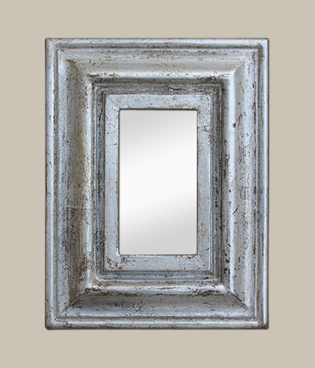 Petit miroir argenté patiné des années 50. Cadre mouluré argenté à la feuille
