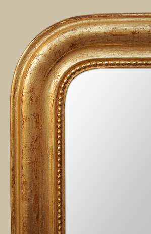 Glace miroir bois doré à décor de perles