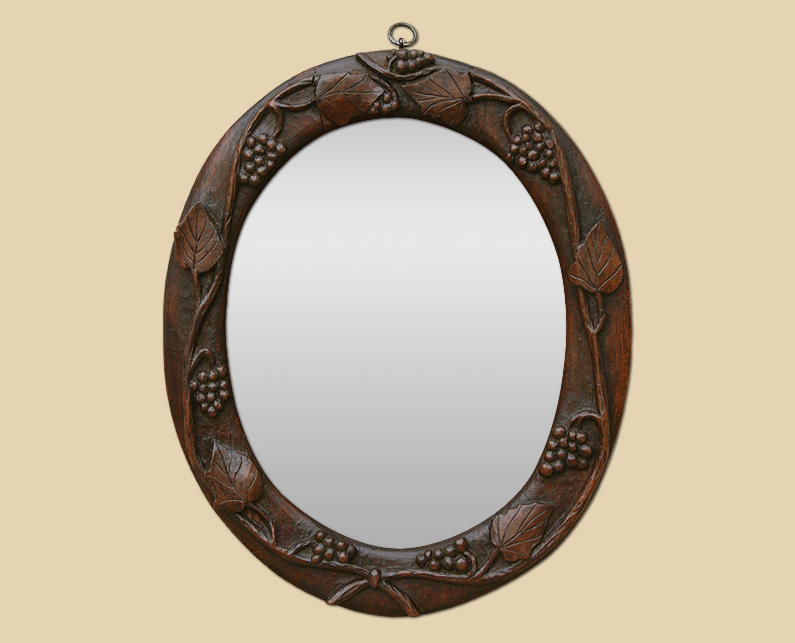 Petit miroir ovale bois sculpté ancien teinte acajou