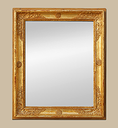 Miroir ancien d'époque Restauration bois doré à décors